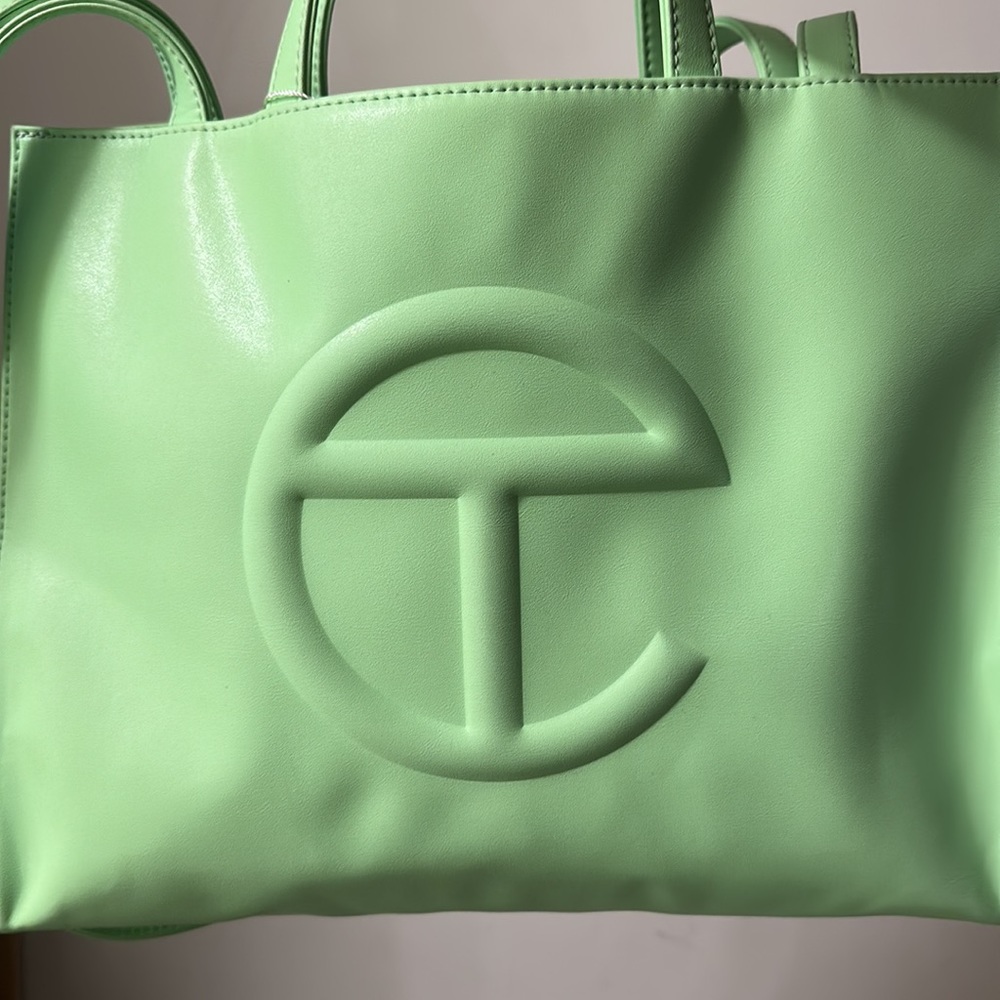 I am selling my double mint medium Telfar ! Dust bag included .